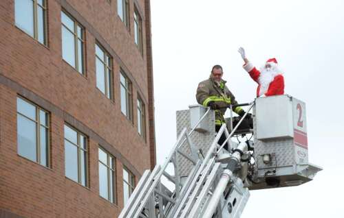 Elgin firefighter - ahem, Santa - surprises kids at Advocate Sherman
