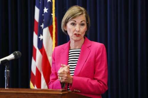 Iowa governor signs abortion law amid court challenge