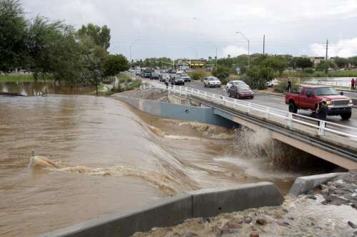 Record Arizona rainfall swamps cars, leaves 2 dead