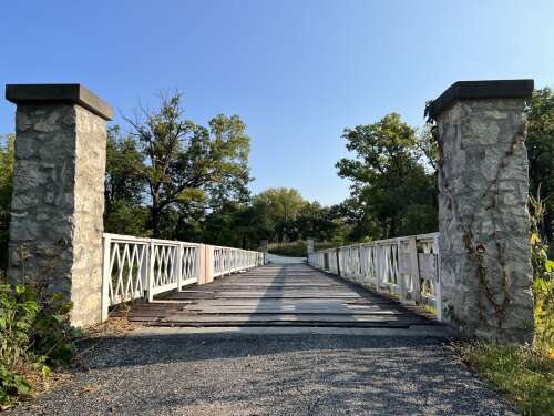 A bridge over the West Branch of the DuPage River used to lead to a religious retreat house run by the Cenacle Sisters near Warrenville.
The woodsy retreat grounds invited visitors to reflect and comm...