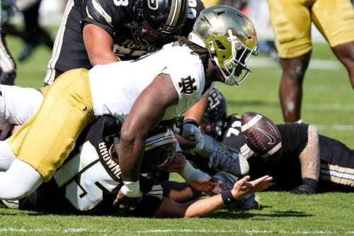 CJ Carr throws for 3 TDs, runs for another to help No. 3 Notre Dame ...