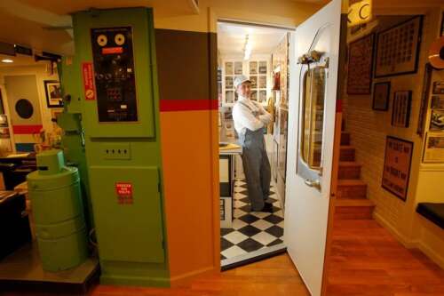 Railroad buff conducts nostalgia in basement museum
