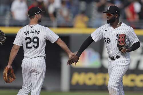 Robert hits an early home run and 5 pitchers lead the White Sox to a 1-0 victory over Chris Sale and the Braves