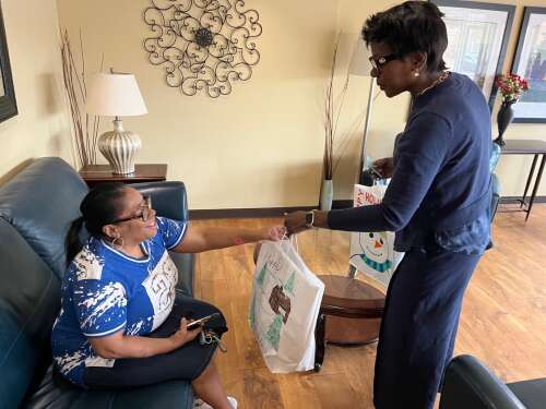 Wheaton resident Margo Parchman’s face lit up when she welcomed Raquel Lightbourne-Coley into the lobby of her apartment building Wednesday morning. After exchanging a hug and Christmas greetings wi...