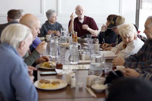 On a chilly January morning, in a room at Richard Walker’s Pancake House in Schaumburg, the wait staff shuttles in trays of savory breakfast fare to a large group tucked into a corner of the eatery....
