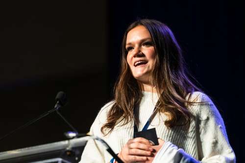 Knee and all, Davies kicks open the door to community service excellence