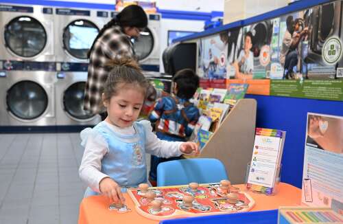Wash and learn: Program brings fundamentals to parents and kids at local laundromats