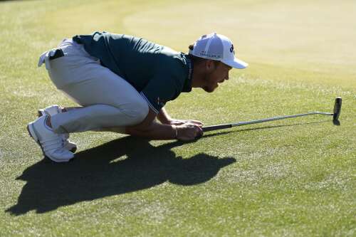 Scottie Scheffler leads Masters by 1 shot on a wild day of movement