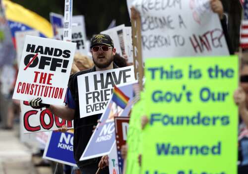 Thousands rallied Saturday at suburban “No Kings” events protesting the policies of President Donald Trump on the same day the president held a military parade in Washington, D.C., marking the U.S...