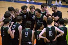 Glenbard West's Xzavion Willett (22) and his teammates celebrate their win agains Lyons at the IHSA Boys Volleyball State Quarterfinals Friday May 31, 2024 in Hoffman Estates.