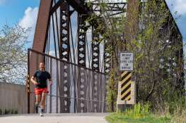 Wheaton resident Paul Mansour, who is running his 50th state marathon in Alaska in June, spends his mornings training on the Illinois Prairie Path.