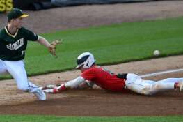 Conant’s Matt Maize slides into third with a triple as Glenbrook North third baseman Ryan Rossi takes the throw during the top of the second inning of the Class 4A baseball supersectional at Wintrust Field on Monday, June 3, 2024 in Schaumburg. Maize scored on a sacrifice fly shortly afterward.