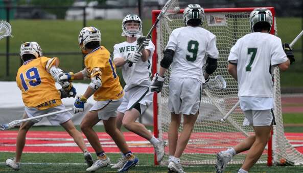 Glenbard West goalie Drew Crosby makes a save against Lake Forest during the boys lacrosse state title game on Saturday, June 1, 2024 in Hinsdale.