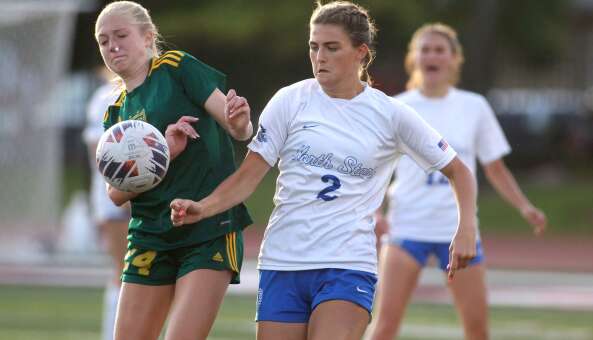Fremd’s Gwen Zimmerman (left) and St. Charles North’s Kayla Floyd try to control the ball during the Class 3A state semifinal game at North Central College in Naperville on Friday, May 31, 2024.
