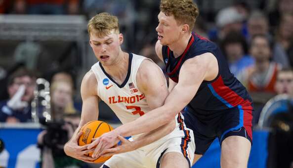 Illinois forward Marcus Domask (3) is tied up by Duquesne forward Jakub Necas (7) in the second half of a second-round college basketball game in the NCAA Tournament, Saturday, March 23, 2024, in Omaha, Neb. (AP Photo/Charlie Neibergall)