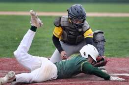 Metea Valley catcher Daniel Bastidas tags out Waubonsie Valley’s Ryan Gustaitis at the plate to end the bottom of the fourth inning during a baseball game played on Thursday, April 18, 2024 in Aurora.