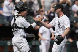 White Sox catcher Korey Lee, left, celebrates with relief pitcher Jordan Leasure after the Sunday’s 4-2 win over Tampa Bay in Chicago.