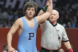 Prospect’s Jaxon Penovich is declared the winner in the Class 3A 190-pound bout at the IHSA state individual boys wrestling championships at the University of Illinois on Saturday, Feb. 17, 2024.