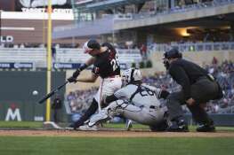 Minnesota Twins' Max Kepler hits an RBI-double during Monday’s 7-0 win over the White Sox in Minneapolis.