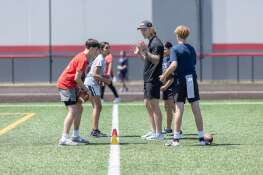 Bears backup quarterback Tyson Bagent shares quarterbacking tips with teenagers Sunday at the TB17 QB Workout, a free youth activity at Nicholas Sportsplex in Mount Prospect.