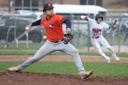 Naperville North’s Yash Desai delivers a pitch as DeKalb's Nikolas Nelson takes his leadoff during their game Thursday, April 18, 2024, at DeKalb High School.