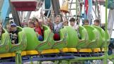 Riders scream and wave to friends and family during last year’s Arlington Heights Frontier Days at Recreation Park.