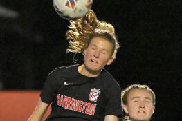 Barrington’s Roos Van Roekel heads the ball against Hersey in the Mid Suburban League championship in Barrington on Wednesday, May 8, 2024.