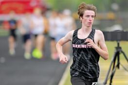 Barrington’s Joe Bregenzer takes a commanding lead in the 3,200-meter run at the Class 3A Metea Valley boys sectional track and field meet in Naperville on Thursday, May 16, 2024.