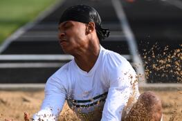 Fremd’s Marquan Brewster lands while competing in long jump during the Class 3A Glenbard North boys track and field sectional on Thursday, May 16, 2024 in Carol Stream.