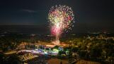The Palatine fireworks at Community Park light up the large crowd and carnival on Monday, July 3, 2023 as seen from a drone 150 feet in altitude looking northwest.