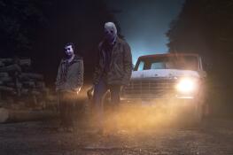 Two of the three mysterious masked serial killers go for a midnight stroll in the horror tale “The Strangers: Chapter 1.”