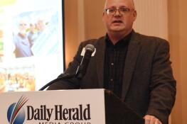 Joe Gleba speaks as Porte Brown is recognized as the top medium company during the Daily Herald’s Best Places to Work event at Abbington Banquets Thursday in Glen Ellyn.