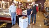 Chocolaterie Stam in Glen Ellyn has a large donation bin to collect food for the College of DuPage Fuel Pantry. From left are Paul Keenon, Rotary Assistant Governor; Rotary board member Erika Krehbiel, chief communications officer for Glen Ellyn School District 41; Liz Mager, owner of Chocolaterie Stam and the club’s past president; and Rob Wilkinson, B.R. Ryall YMCA CEO and president of the Glen Ellyn Rotary Club.