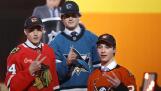 Artyom Levshunov, left, second overall pick of the Chicago Blackhawks; Macklin Celebrini, center, first overall pick of the San Jose Sharks; and Beckett Sennecke, third overall pick of the Anaheim Ducks, pose during the first round of the NHL hockey draft Friday, June 28, 2024, in Las Vegas. (AP Photo/Steve Marcus)