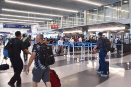 Travelers check in for flights at O’Hare International Airport’s Terminal 3. With a surge in trips this holiday weekend, it’s a good idea to get to the airport two hours in advance of your flight.