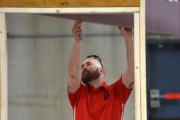 Cody Laveck is among the Solid Rock Carpenters volunteers who have been working in a Mount Prospect warehouse on walls for 16 homes being built for people in need in Appalachia.