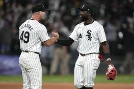Chicago White Sox's Jordan Leasure and Bryan Ramos celebrate the team's 6-3 win over the Cleveland Guardians in a baseball game Friday, May 10, 2024, in Chicago. (AP Photo/Charles Rex Arbogast)