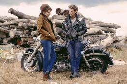 Kathy (Jodie Comer) shares a thoughtful moment with leader of the pack Benny (Austin Butler) in "The Bikeriders."