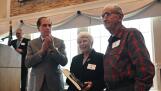 Schaumburg Mayor Tom Dailly, left, congratulates Sandy and Tony Meo, winners of the village’s Volunteer of the Year Award in the adult category. The couple, which has volunteered for decades at Spring Valley Nature Center, were honored Tuesday during the 36th annual awards luncheon.