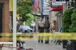 Police investigate the deadly shooting during that occurred July 4, 2022 during Highland Park’s Independence Day parade. A Lake County judge ordered the accused shooter be allowed to phone his parents and siblings. His phone privileges were suspended in December after authorities say he violated jail rules.