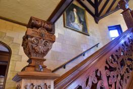 A craftsman took 15 months to restore the walnut staircase in Mayslake Hall in Oak Brook. A portrait of Chicago industrialist Francis Stuyvesant Peabody hangs in the stairway. He commissioned the mansion’s construction from 1919 to 1921.