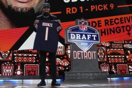 Washington wide receiver Rome Odunze poses after being chosen by the Chicago Bears with the ninth overall pick during the first round of the NFL football draft, Thursday, April 25, 2024, in Detroit. (AP Photo/Jeff Roberson)