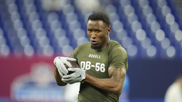 Minnesota defensive back Tyler Nubin runs a drill at the NFL football scouting combine, Friday, March 1, 2024, in Indianapolis. (AP Photo/Michael Conroy)
