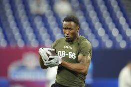 Minnesota defensive back Tyler Nubin runs a drill at the NFL football scouting combine, Friday, March 1, 2024, in Indianapolis. (AP Photo/Michael Conroy)
