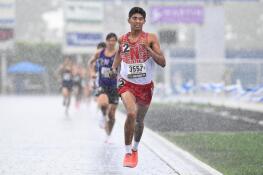 Naperville Central’s Samir Hussain runs in the rain during the 2022 IHSA Class 3A state boys track and field meet at Eastern Illinois University.