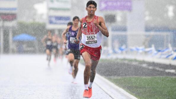 Naperville Central’s Samir Hussain runs in the rain during the 2022 IHSA Class 3A state boys track and field meet at Eastern Illinois University.