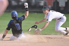 Libertyville’s Cole Lockwood tags out Lake Zurich’s Jonathan Fleaka in the first inning in a baseball game in Libertyville on Tuesday, April 23, 2024.