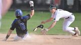 Libertyville’s Cole Lockwood tags out Lake Zurich’s Jonathan Fleaka in the first inning in a baseball game in Libertyville on Tuesday, April 23, 2024.