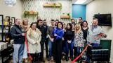 Marilyn Monte, the new owner of Fluent Hair Studio, cuts the ribbon to celebrate the re-opening of the salon under her ownership. Monte is joined by family, friends, and the staff and board members of the Cary-Grove Area Chamber of Commerce.