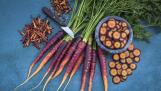 Lila Lu Sang heirloom carrots are deep purple on the outside and bright orange on the inside. The carrots are sweet, tasty and nutrient-dense.
